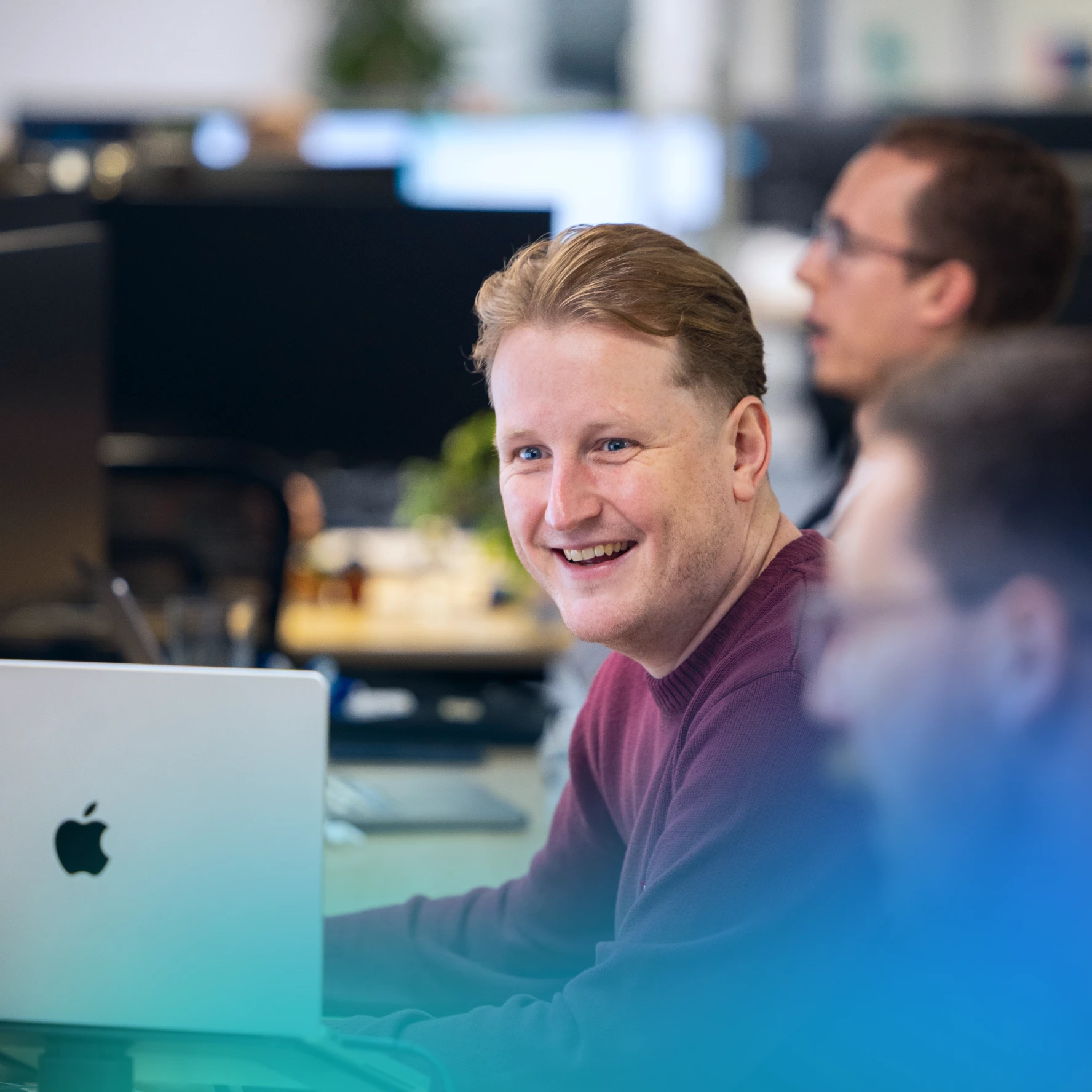 man smiling in an office