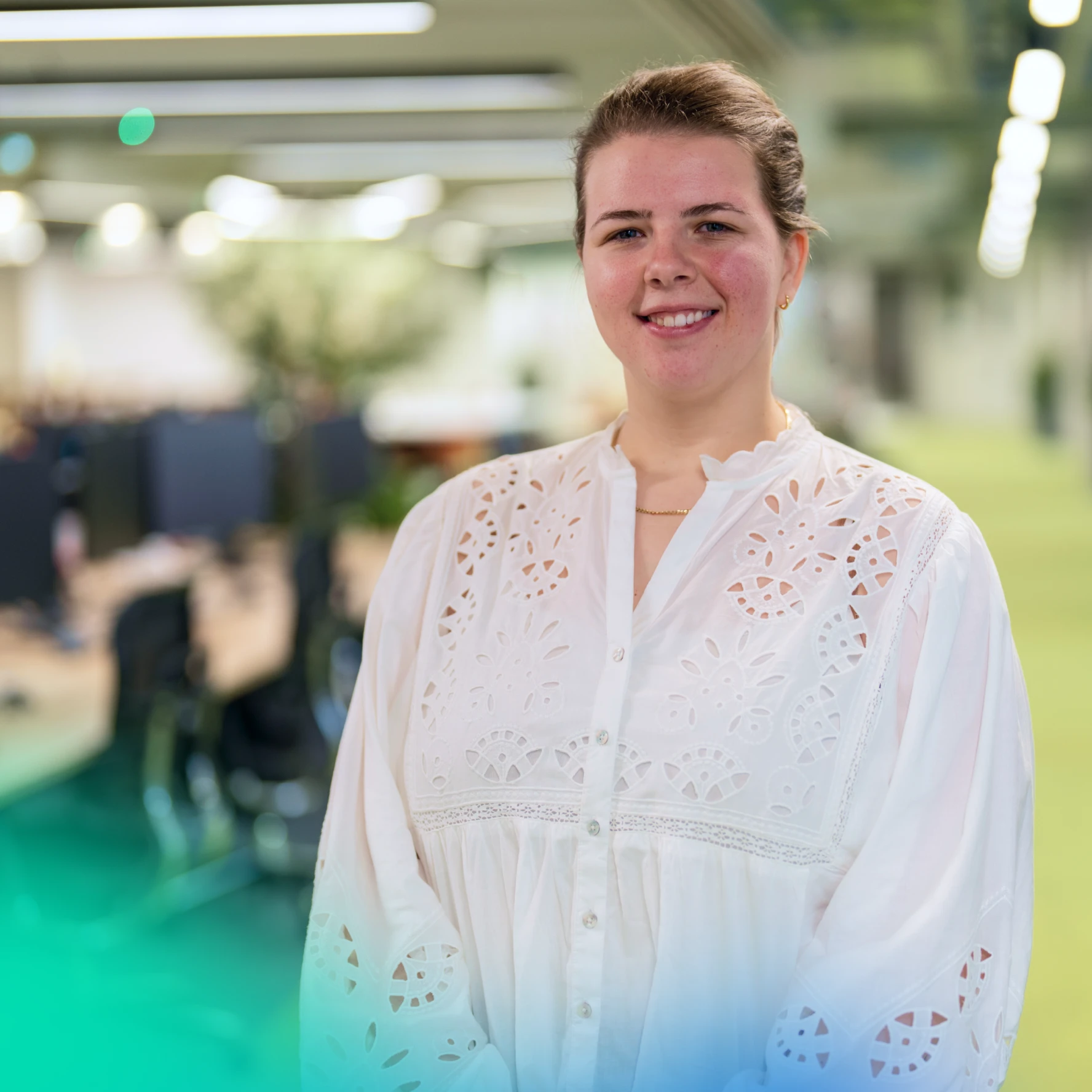 Woman looking at a camera in an an office