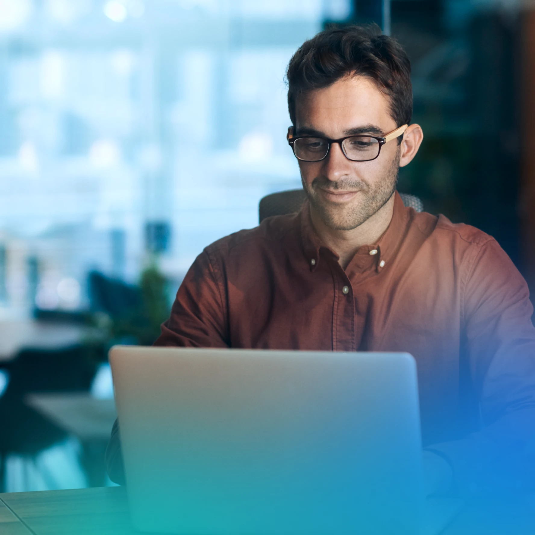 Man at a laptop in an office