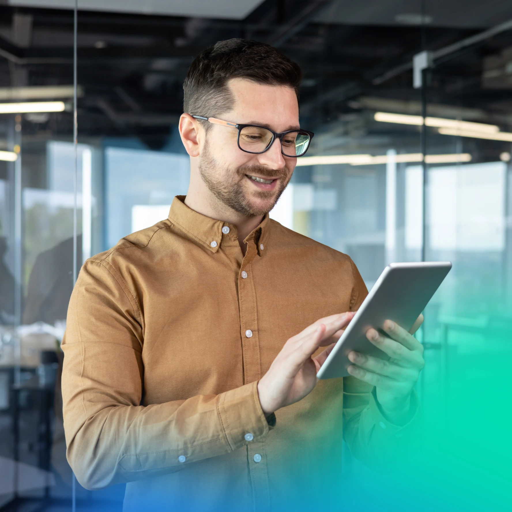 man on a tablet in a car dealership