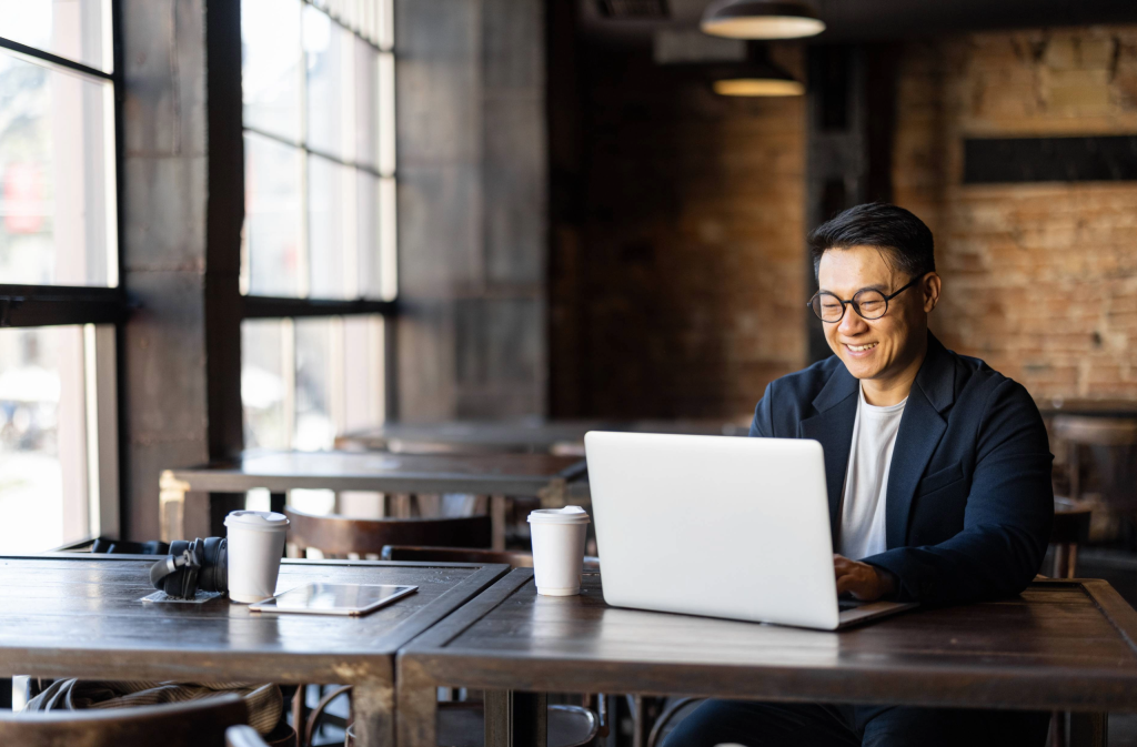 Man on his laptop in a coffee shop