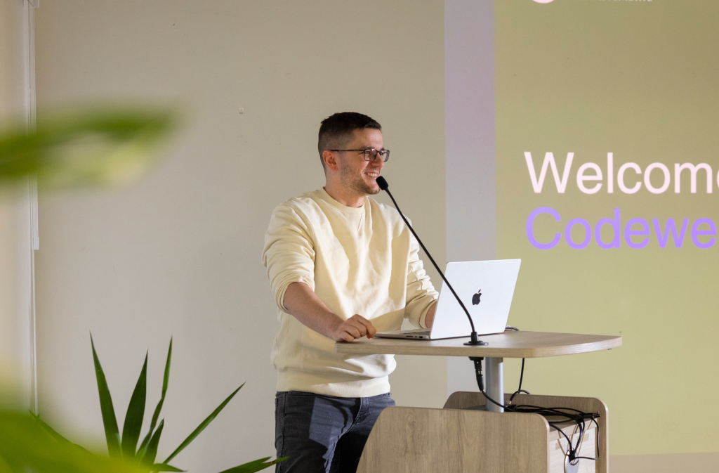 Man standing at a podium in an office